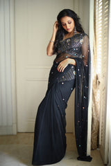 Black embroidered saree with sleeveless blouse