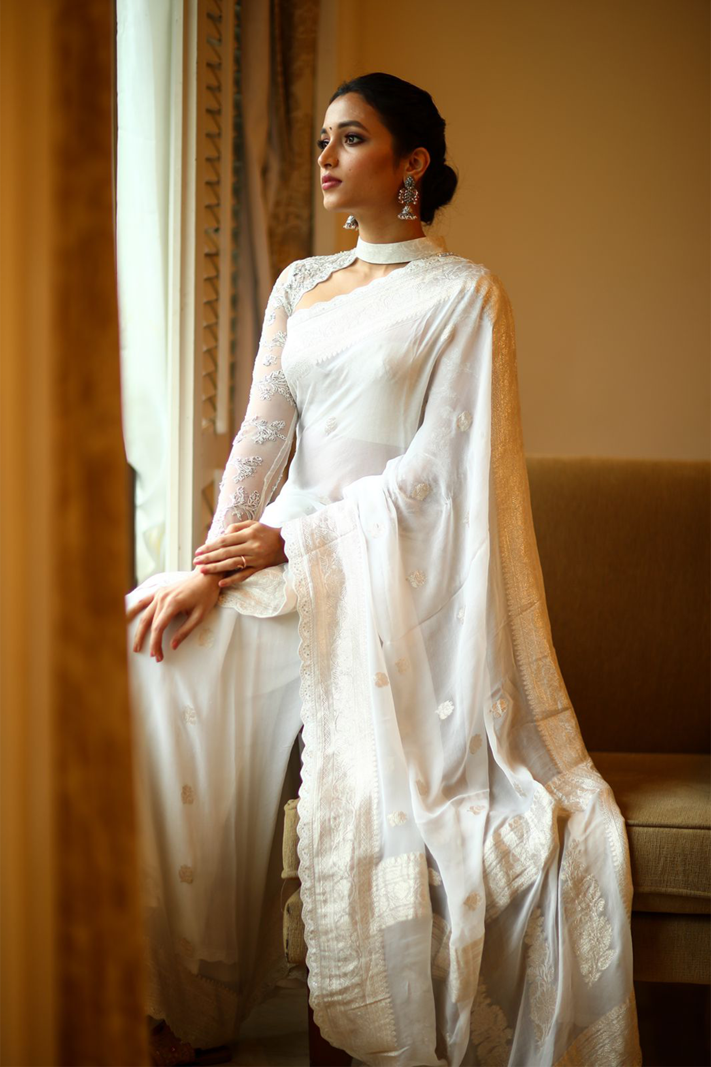 Srinidhi Shetty in White banaras saree paired with embroidered blouse