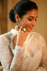 White banaras saree paired with embroidered blouse