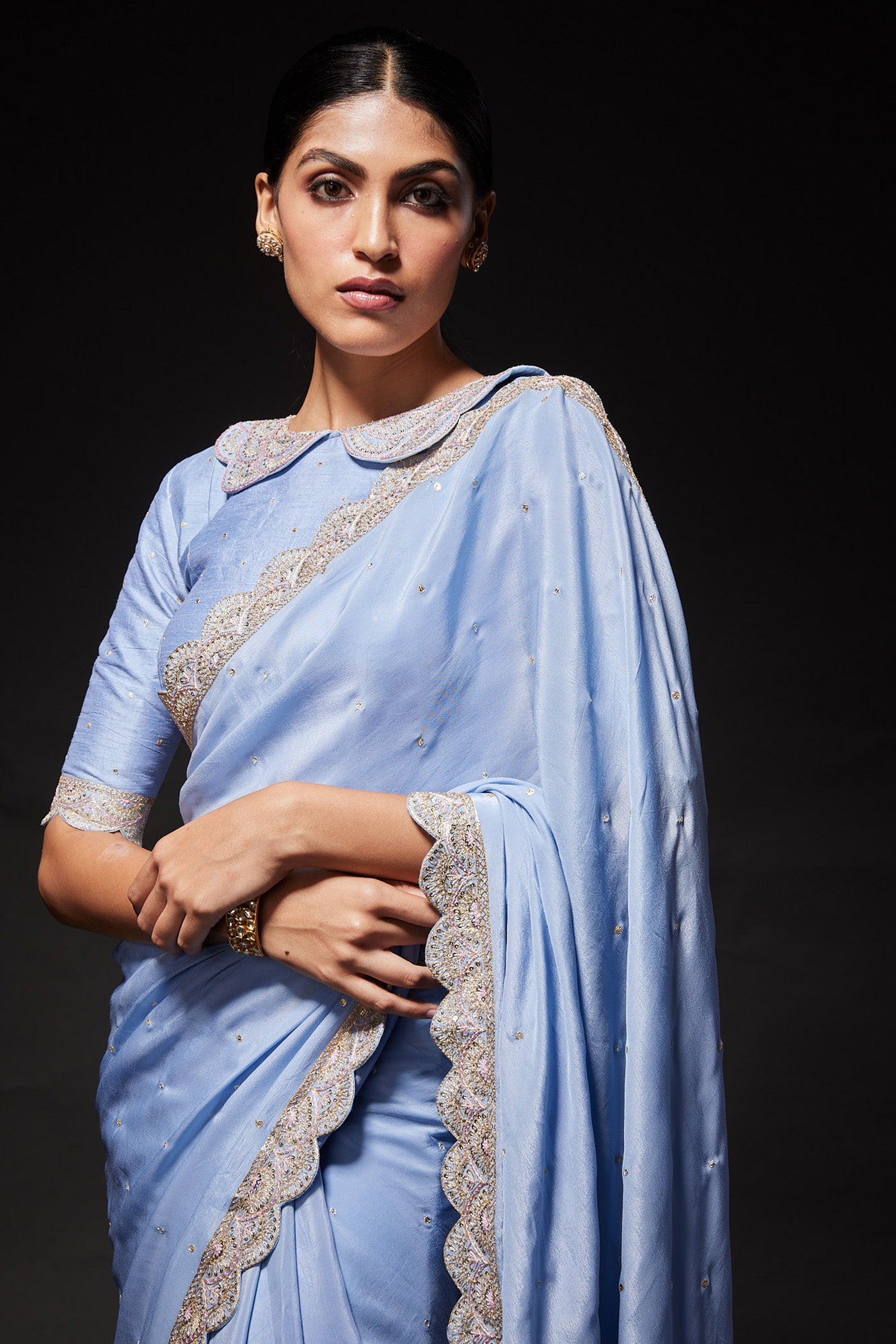 Powder blue scallop embroidered saree with peterpan collared blouse