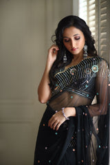 Black embroidered saree with sleeveless blouse