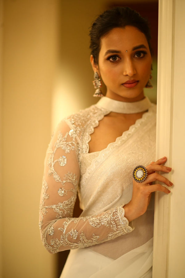 White banaras saree paired with embroidered blouse