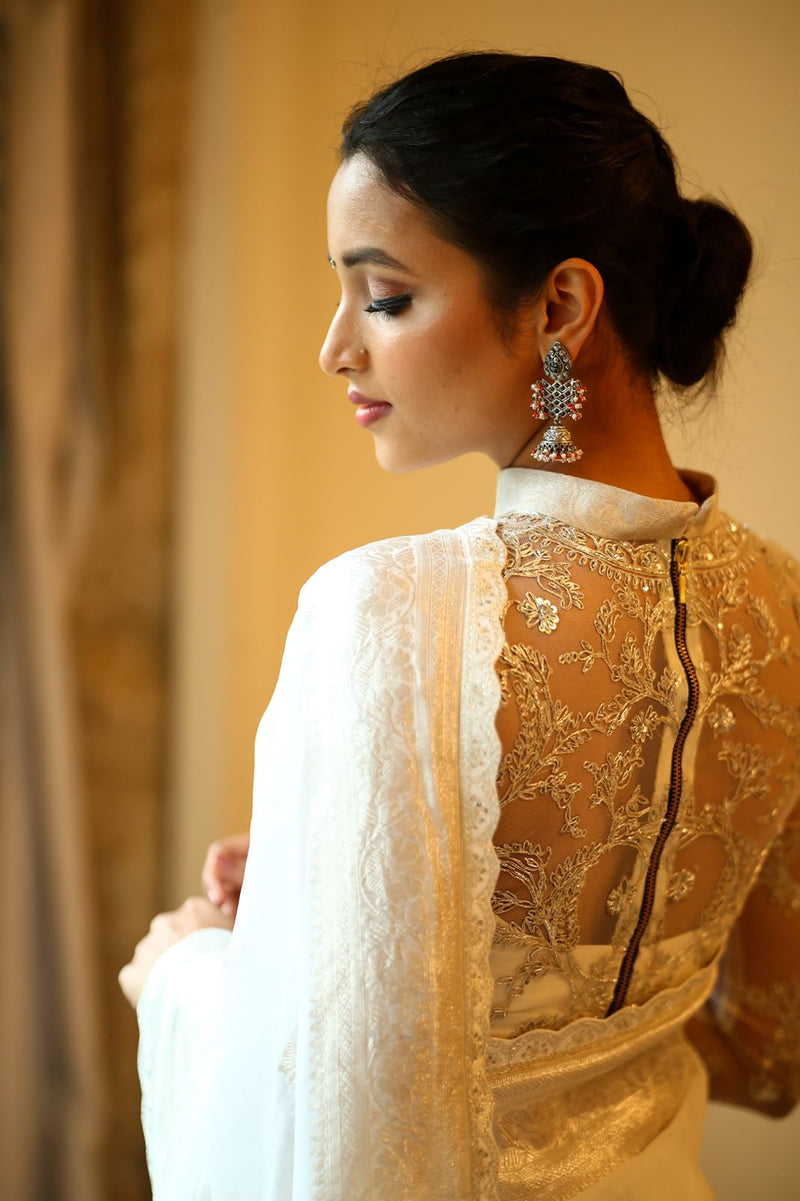 White banaras saree paired with embroidered blouse